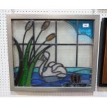 A framed stained glass panel depicting a swan and bullrushes Condition Report:No condition report