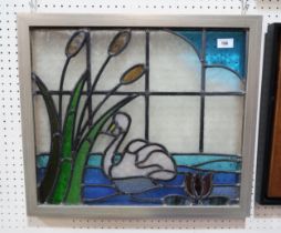 A framed stained glass panel depicting a swan and bullrushes Condition Report:No condition report