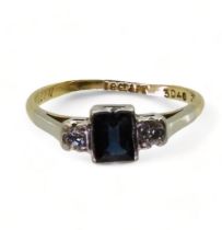 An 18ct and platinum sapphire and diamond ring set with a square cut sapphire of approx 5mm x 4mm