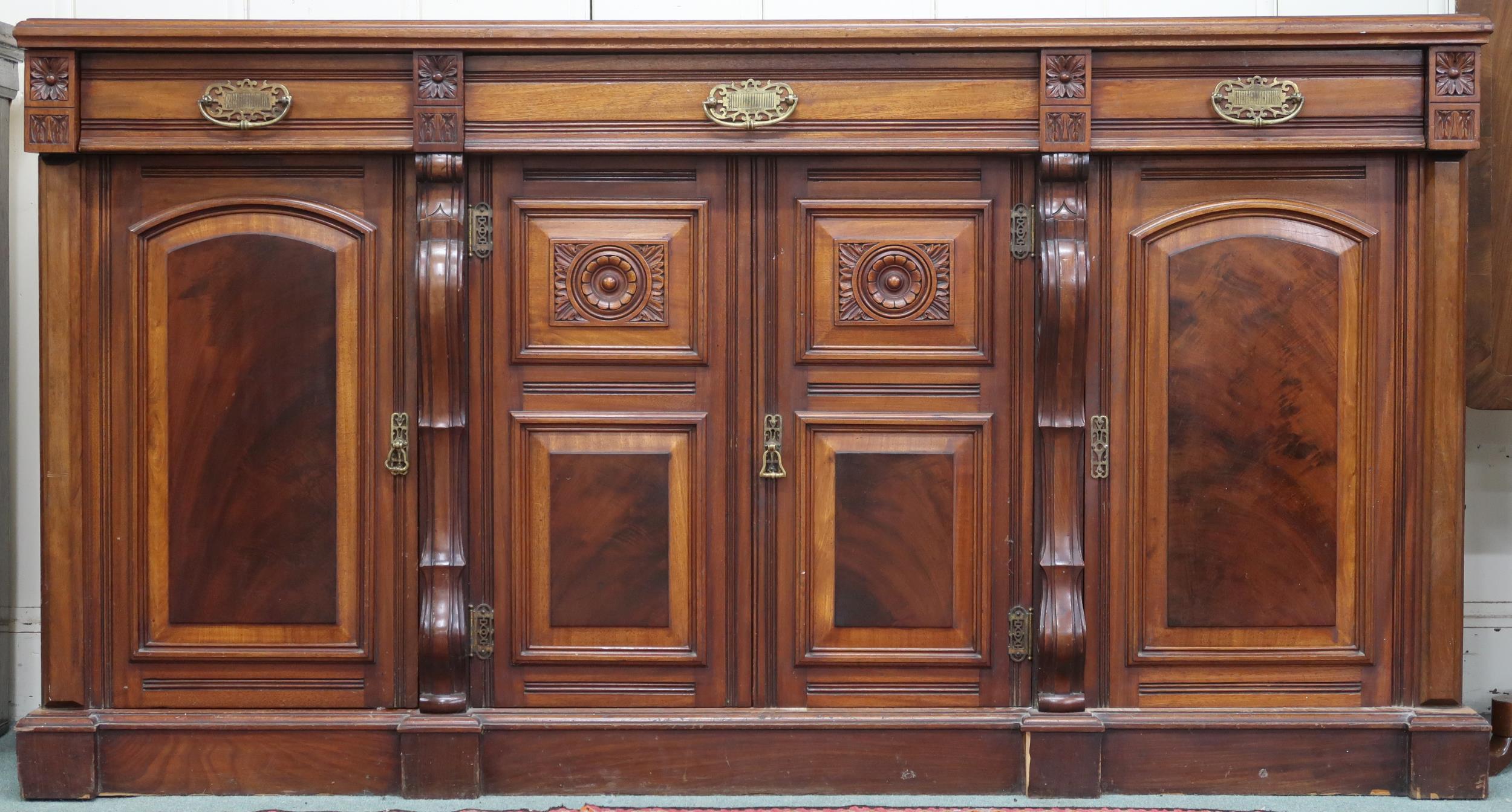 A late Victorian mahogany sideboard with four short drawers over four cabinet doors, 98cm high x
