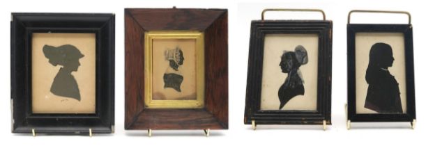 A 19th century silhouette portrait miniature of a lady in profile, housed in a rosewood frame with