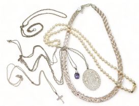 A string of pearls with a 9ct gold clasp, a bi colour silver plaited necklace and other pendants and