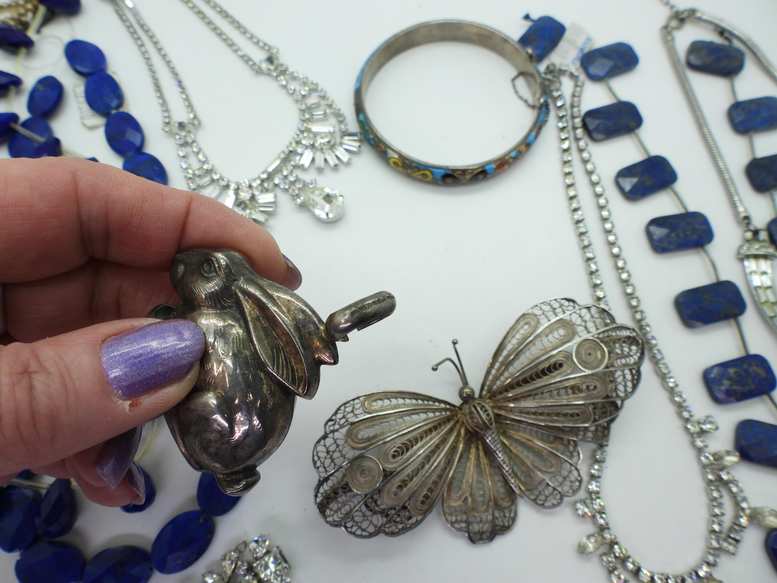 Three strings of lapis lazuli beads, a partial hare babies rattle stamped 'Alpacca made in - Image 3 of 3