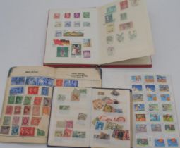 Various worldwide stamps in three mini albums  Condition Report:Available upon request