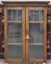 A 20th century oak two door glazed bookcase, 100cm high x 79cm wide x 26cm deep Condition Report: