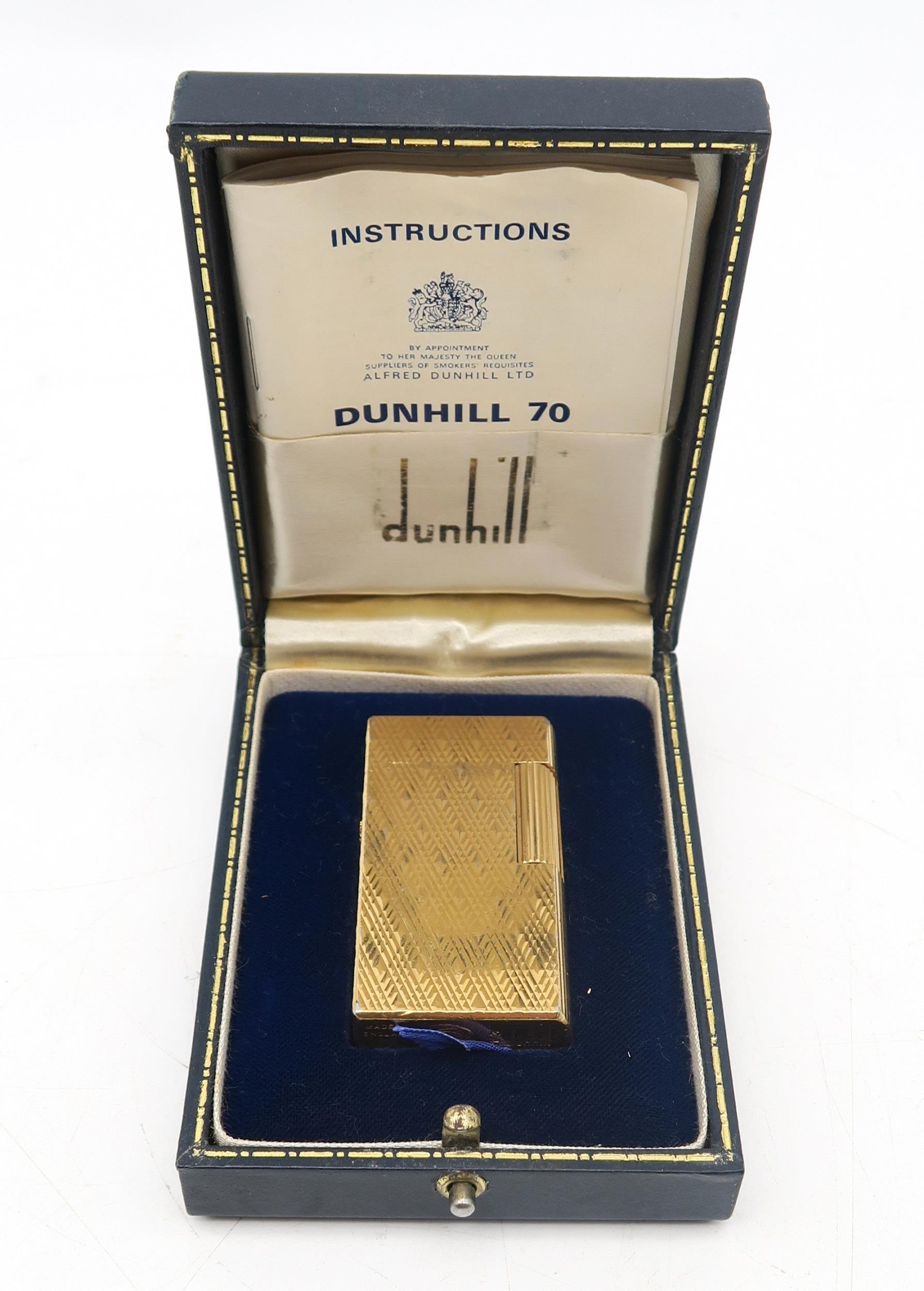 A vintage Dunhill 70 gold-plated cigarette lighter, no. M813, housed in its original fitted case