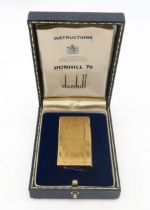 A vintage Dunhill 70 gold-plated cigarette lighter, no. M813, housed in its original fitted case