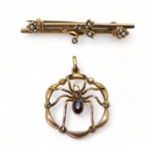 A 9ct gold garnet set spider pendant, diameter 2.2cm and a 9ct gold brooch, weight together 4gms