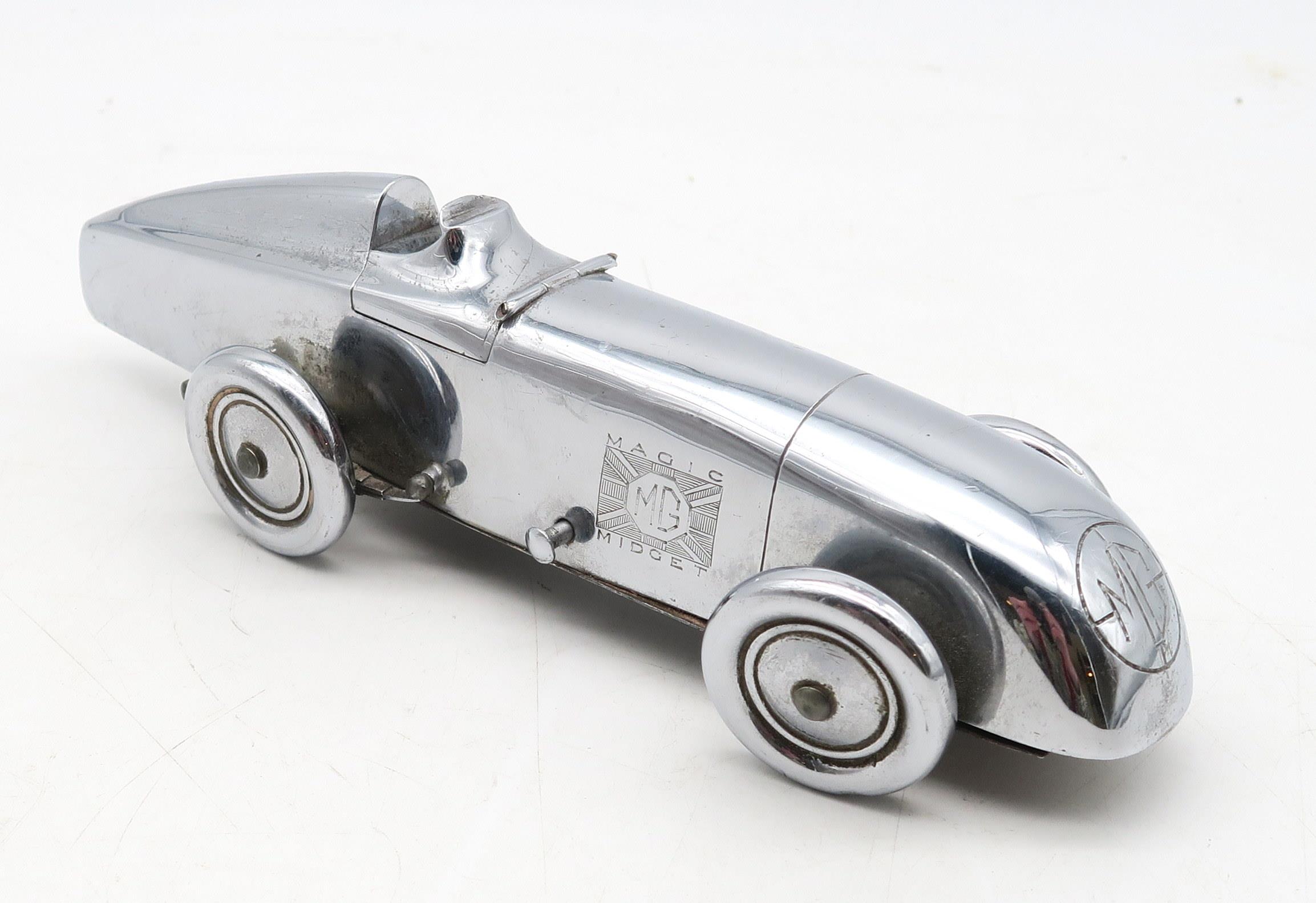 A chrome-plated Art Deco MG "Magic Midget" table lighter, marked to the underside "S&M, Made in