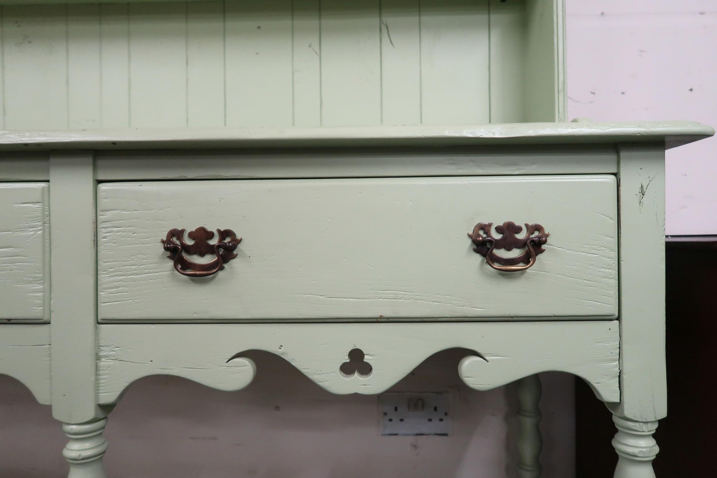 A pastel green painted Welsh style kitchen dresser with moulded cornice over two open shelves on - Image 2 of 3
