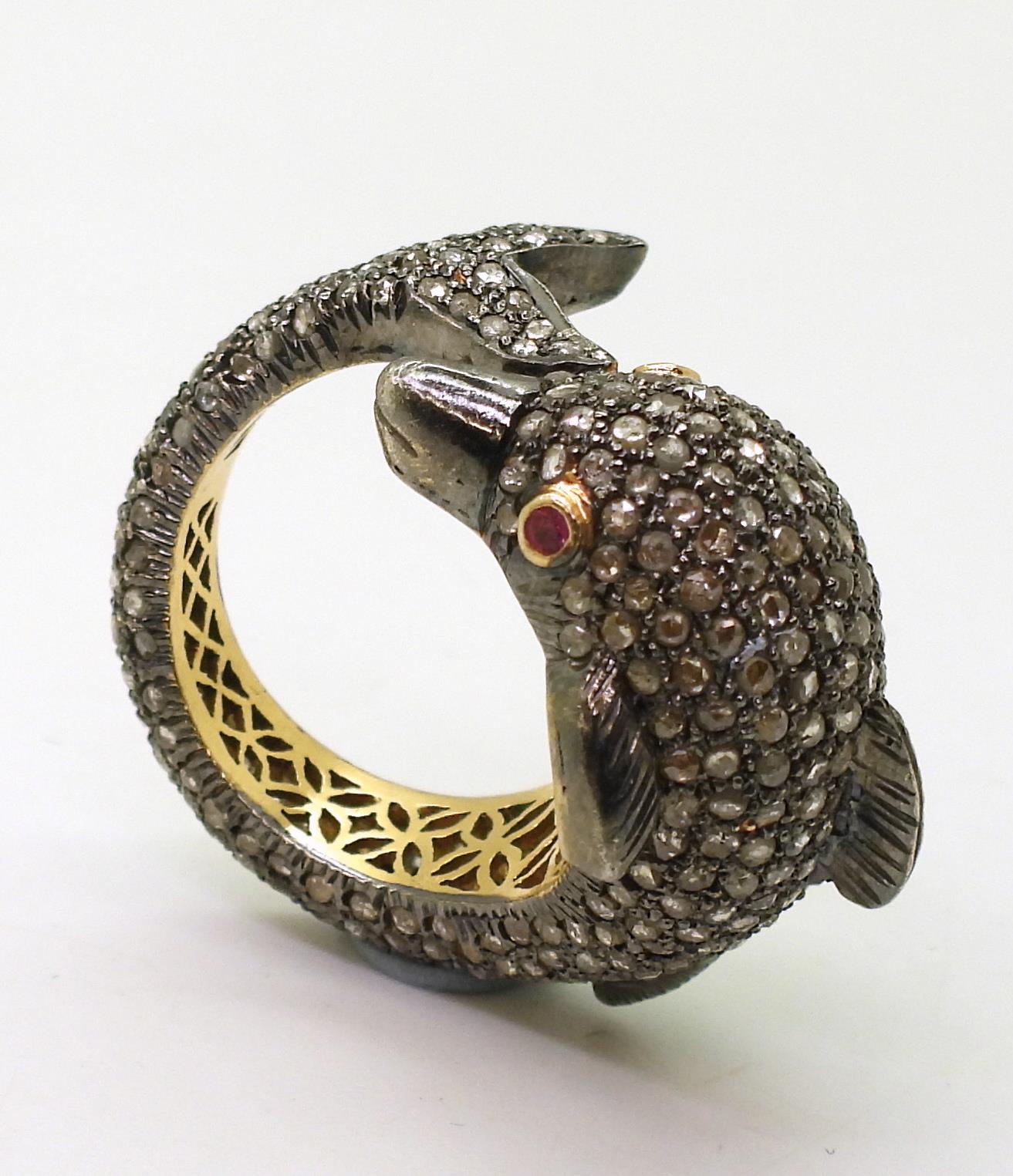 A yellow and white metal dolphin ring completely pave set with rose cut diamonds, with ruby set - Image 2 of 4