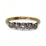An 18ct gold and platinum five stone diamond ring set with estimated approx 0.15cts of brilliant cut