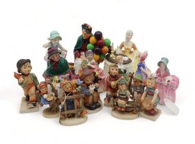 A collection of sixteen figures including Royal Doulton, Royal Worcester and Hummel  Condition