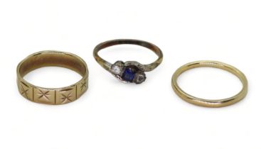 A 9ct gold wedding ring with engraved star pattern, size M1/2, a wedding band, size O, and a blue