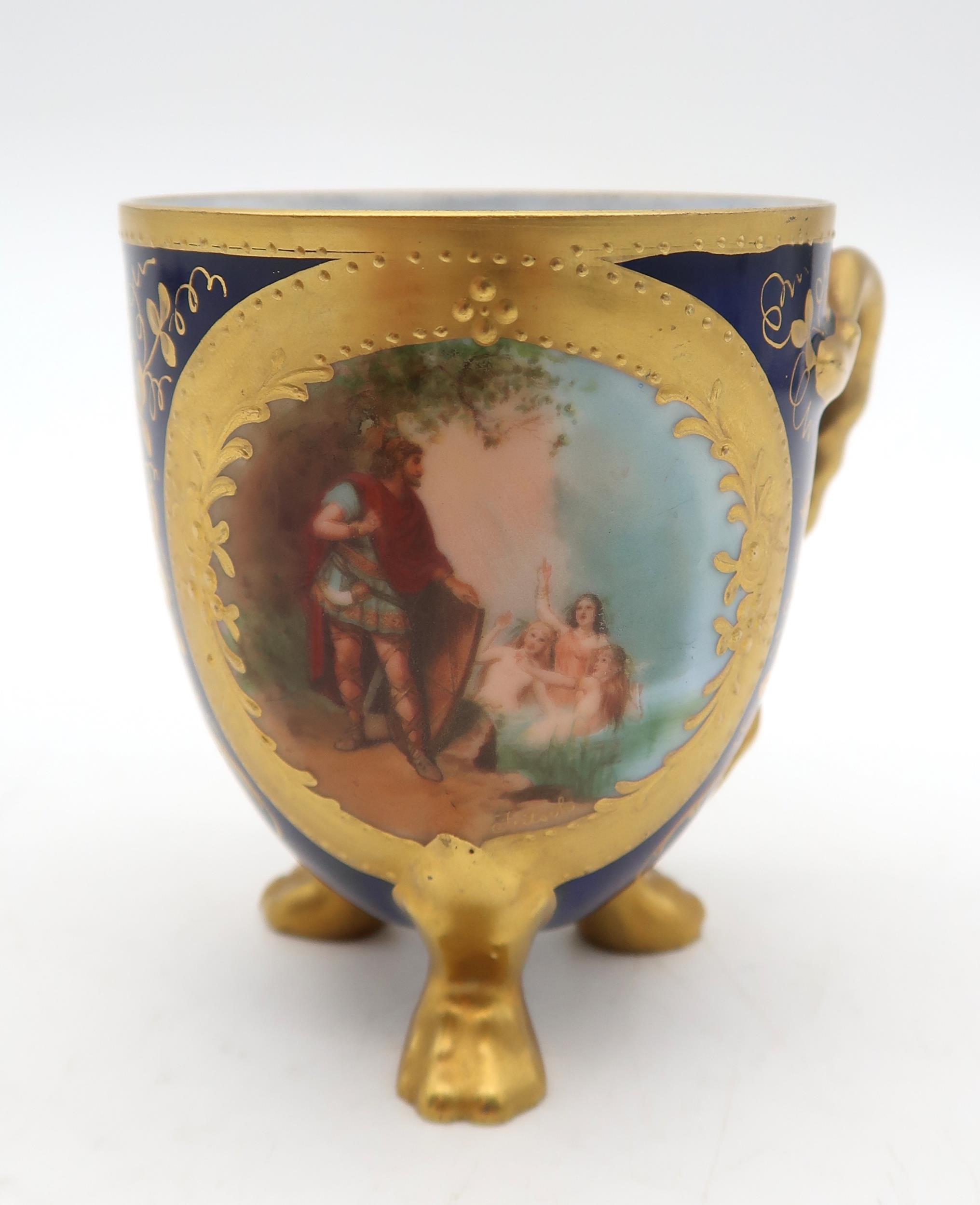 A continental porcelain cup, transfer printed with a scene of Siegfried and the Rhine daughters - Image 2 of 5
