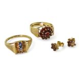 A 9ct gold retro garnet cluster ring, size M1/2, and a pair of garnet earrings, together with a blue