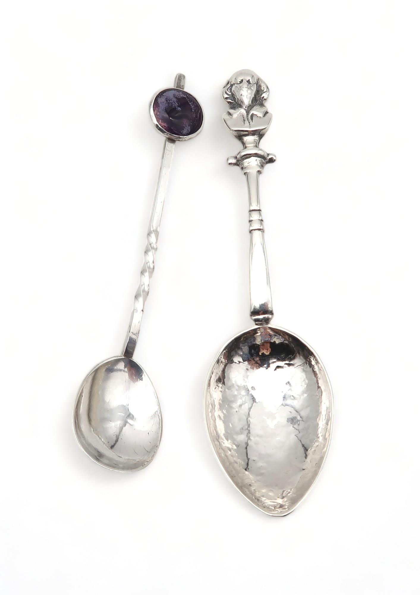 An Arts and Crafts silver spoon, by Winifred King & Co, Birmingham 1927, with a hammered and pointed