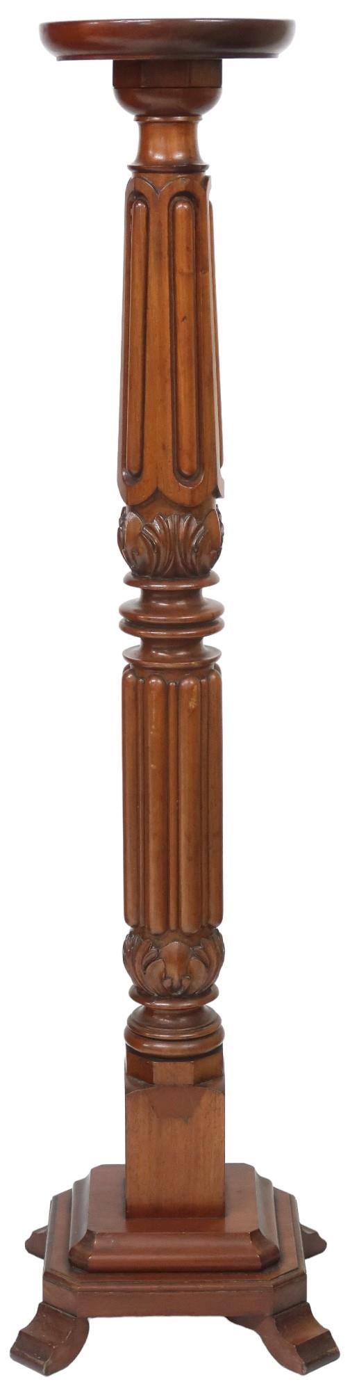 A 20th century mahogany circular topped torchiere carved column on square stepped base, 139cm high x