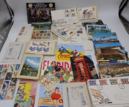 A lot comprising post cards, loose stamps and cut outs. Condition Report:Available upon request