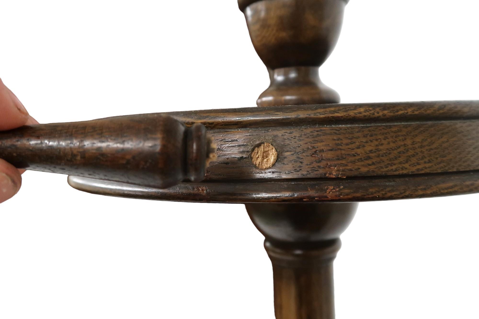 An early 20th century stained oak coat stand with turned finial top over four revolving pegs (one - Image 4 of 4