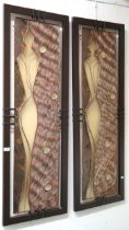 A pair of 20th century stained teak framed metal and fibreglass abstract wall art pieces, 143cm high
