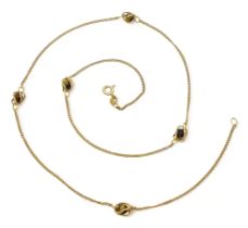 A 9ct gold chain with cage set tiger's eye beads along its length. Length 54cm, weight 5.4gms