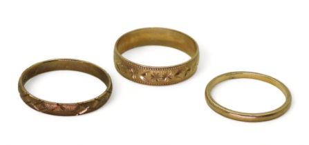 Three 9ct gold wedding bands, sizes R1/2, R, and  M, weight together 4.5gms Condition Report: