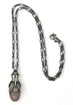 A silver Georg Jensen bud shaped pendant set with rose quartz, stamped 2011 (pendant of the year