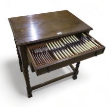 A two drawer oak canteen of stainless steel ivorine handled cutlery, by Walker & Hall (jammed)