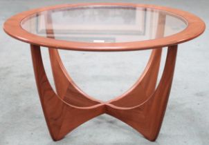 A lot comprising a mid 20th century teak G Plan "Astro" glass topped circular coffee table with