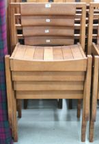 A lot of four 20th century teak stacking church seats with slatted seats on square supports, some