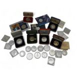 A lot of commemorative silver coins to include U.S. One Dollar and Chinese Zodiac examples