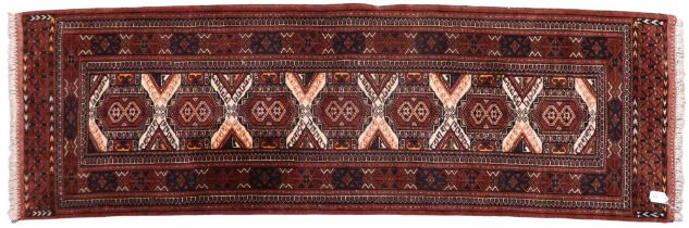 A multicoloured geometric ground Heriz style runner, 196cm long x 62cm wide  Condition Report: