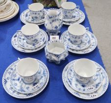 A Royal Copenhagen teaset. comprising six trios, milk jug and sugar bowl in the onion pattern