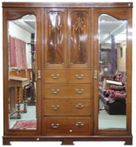 An Edwardian mahogany and satinwood inlaid compactum style wardrobe with pair of central cabinet