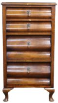 An early 20th century mahogany Ogee style four drawer chest with two shallow over two deep