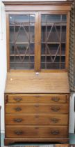 An early 20th century mahogany bureau bookcase with mould cornice over pair of astragal glazed doors