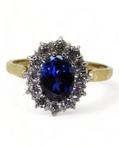 A blue and clear cz flower cluster ring, set in 14ct gold, size R1/2, weight 3.8gms Condition