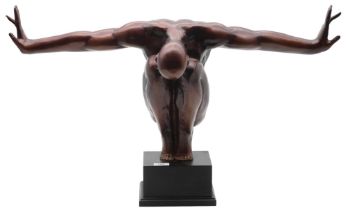 A patinated metal sculpture of a crouched man with arms outstretched, on black plinth base Condition