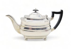 A George V silver tea pot, by William Hutton & Sons, Sheffield 1936, of squat rectangular form,