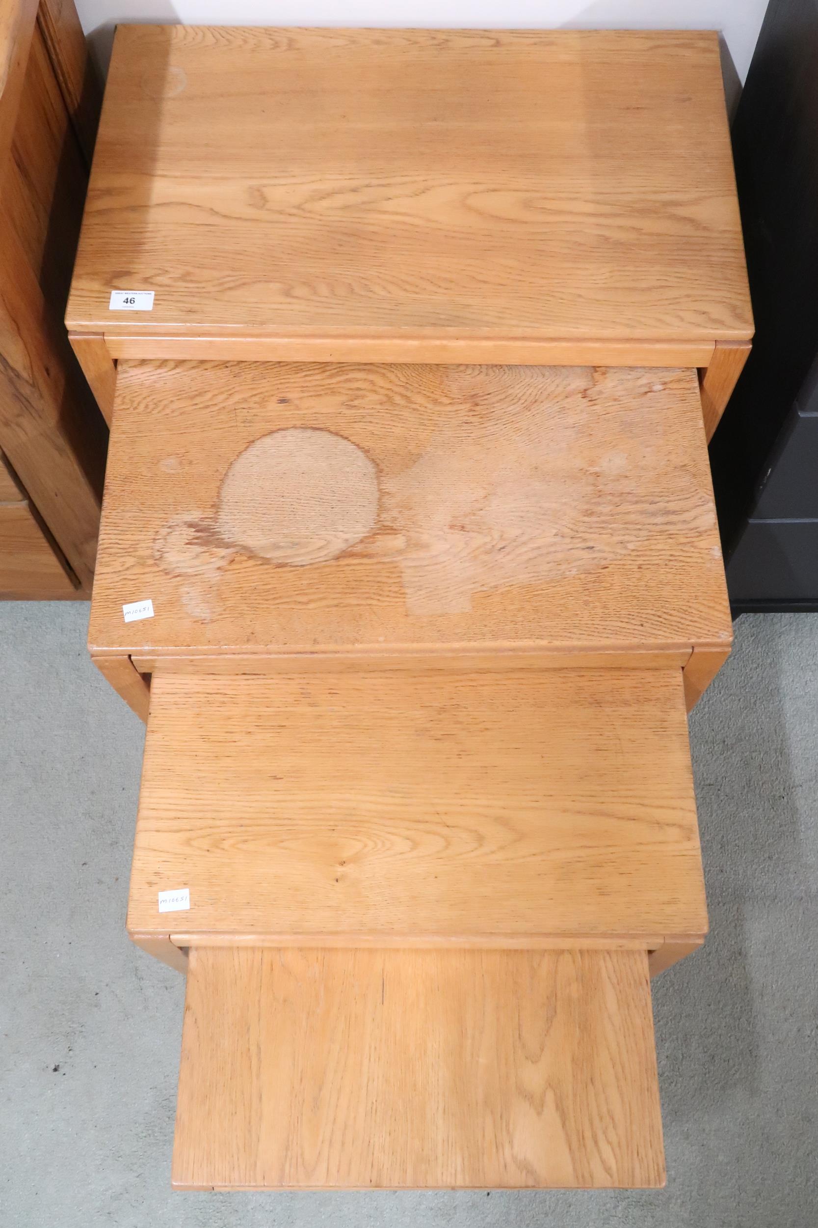 A 20th century blonde oak nest of four tables on square tapering supports, 56cm high x 61cm wide x - Image 2 of 2