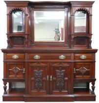 A late Victorian mahogany mirror backed sideboard with shaped dentil cornice over central bevelled
