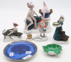 A collection of Rosenthal porcelain models including a naked girl sitting with her parrot, incised