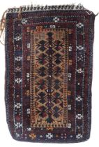 A multicoloured geometric patterned tribal saddle bag, 83cm high x 54cm wide  Condition Report:
