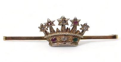 A 9ct gold starry crown bar brooch, set with diamonds, rubies and an emerald, length 5cm, weight