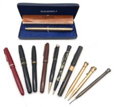 A collection of vintage fountain pens and propelling pencils, to include a Waterman's example with