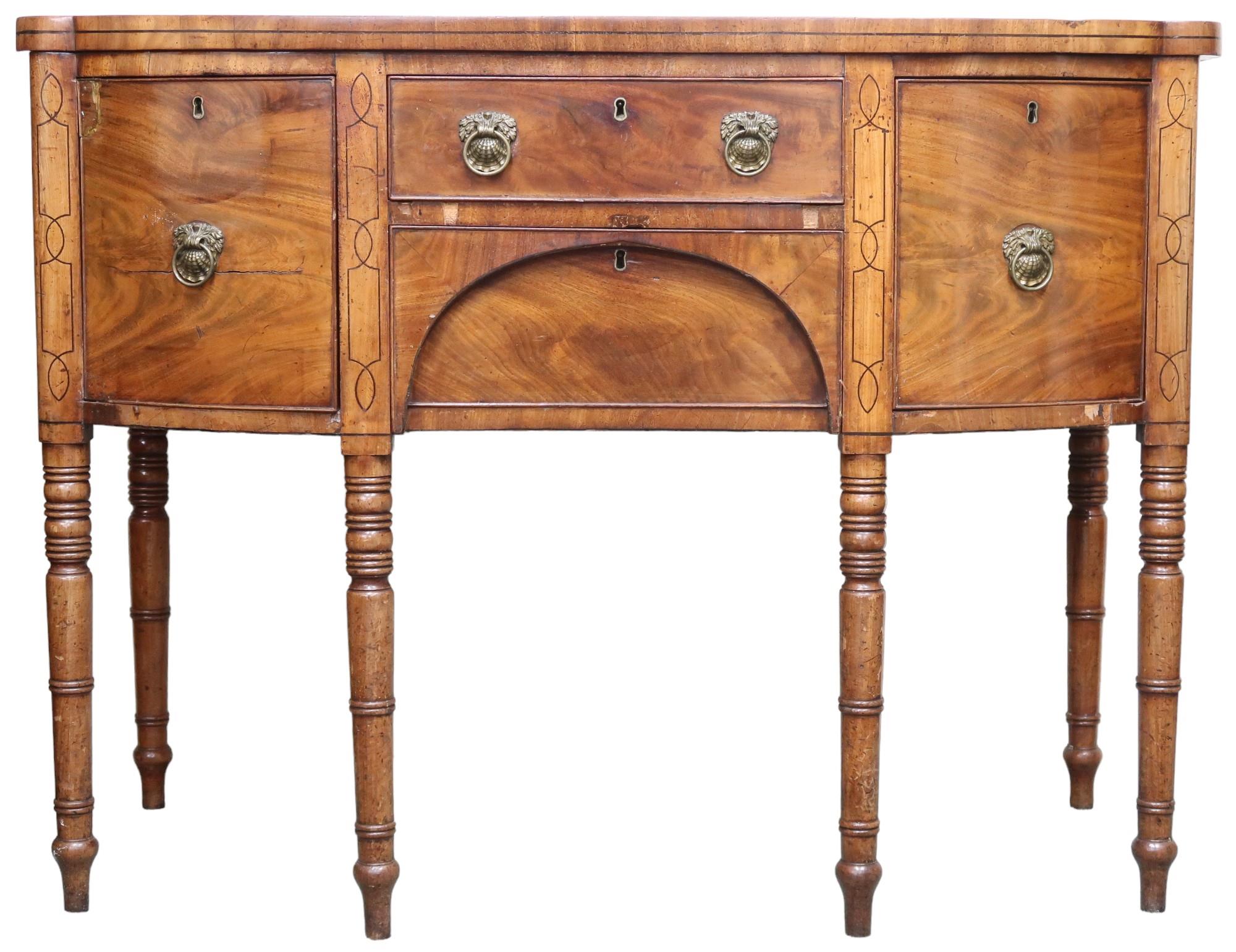 A 19th century mahogany bowfront sideboard with two central drawers flanked by bowed doors with