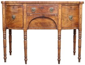 A 19th century mahogany bowfront sideboard with two central drawers flanked by bowed doors with