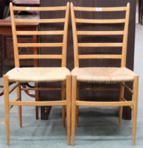 A pair of Italian beech framed ladder back chairs in the manner of Gio Ponti with rushed seats on