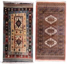 A lot comprising cream ground Bokhara style rug with three central lozenges and multicoloured